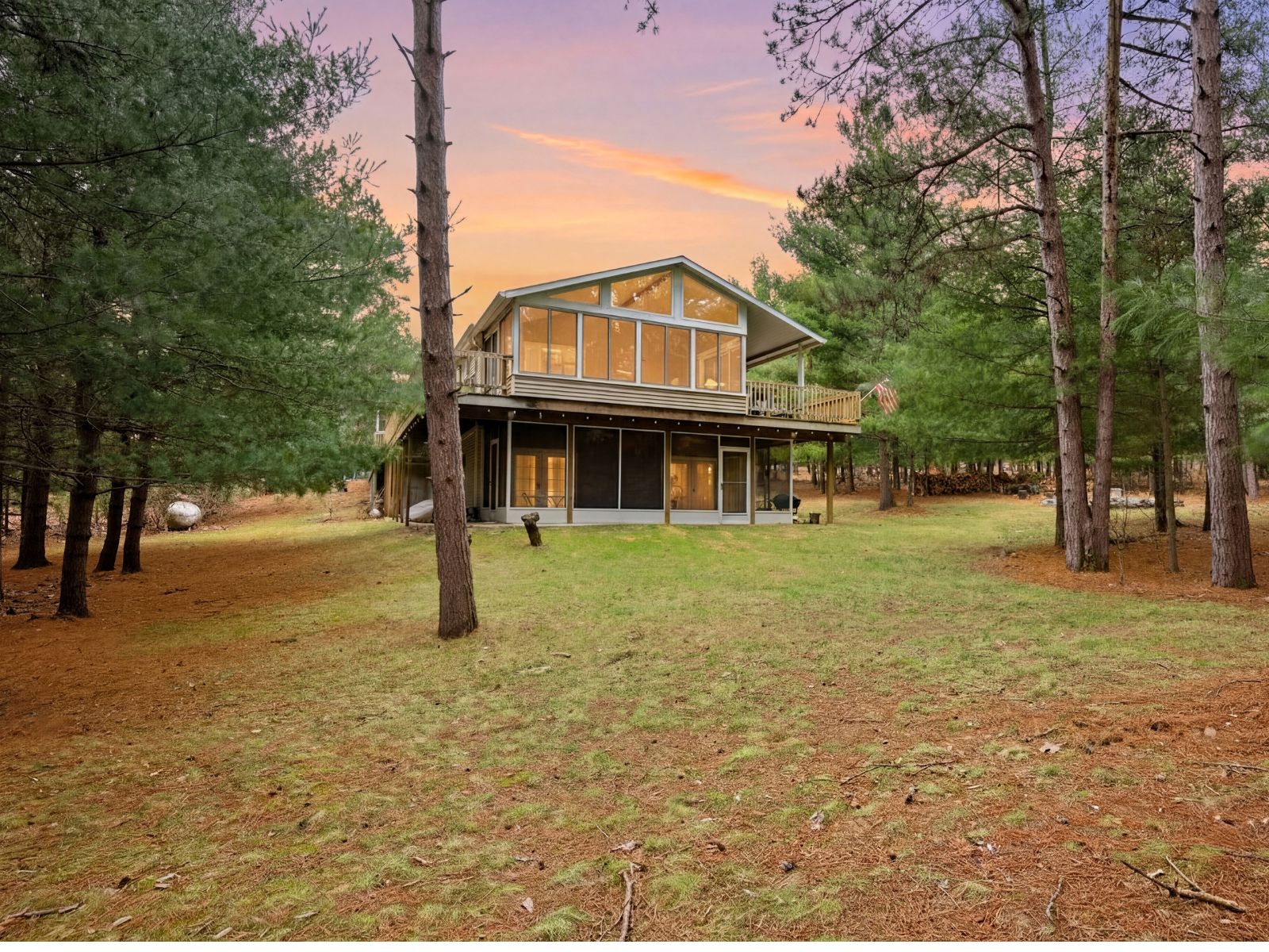The Wisconsin Dells property exterior at dusk, surrounded by pine trees